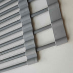 Roll-up dish drying rack on a kitchen sink