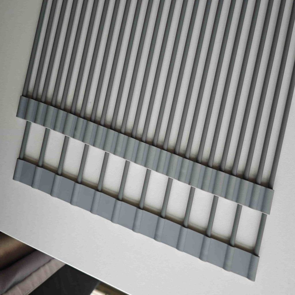 Gray over-sink roll-up drying rack