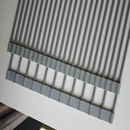 Gray over-sink roll-up drying rack